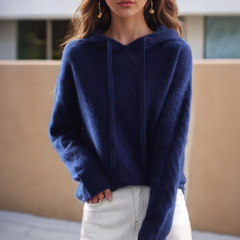 Blue cable-knit hoodie with drawstring hood and long sleeves
