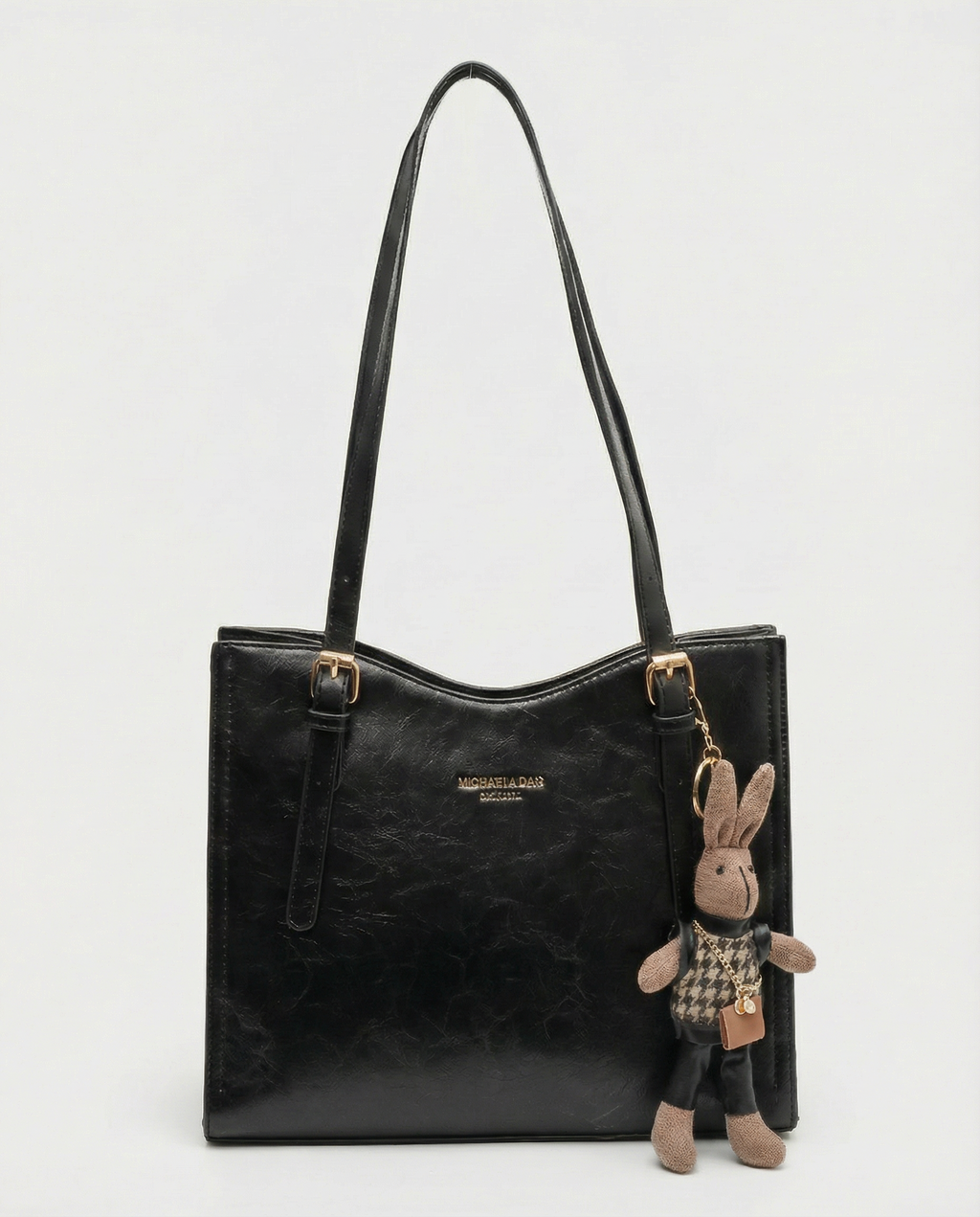 Black vegan leather small crossbody tote bag with top handles and bunny charm keychain.