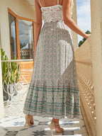 Bohemian floral A-line maxi skirt with elastic high waist, tiered border hem, teal band print.