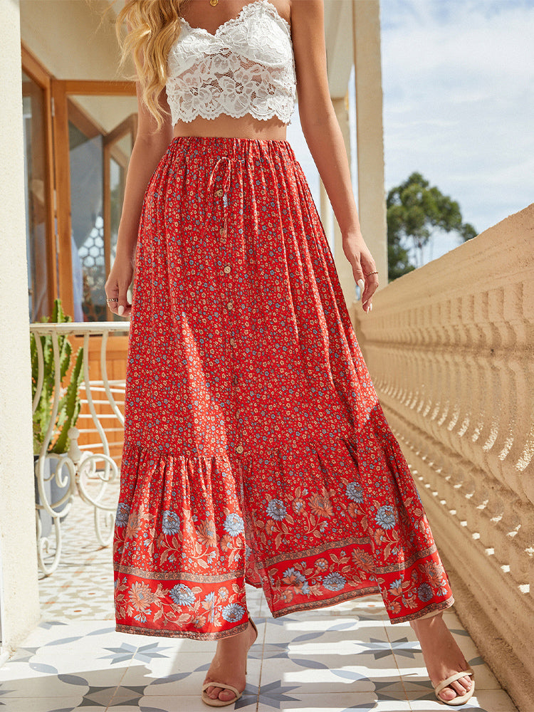 Bohemian floral A-line maxi skirt with elastic high waist, tiered border hem, red border print.