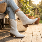 White perforated western ankle boots with block heel and pull-on side tabs