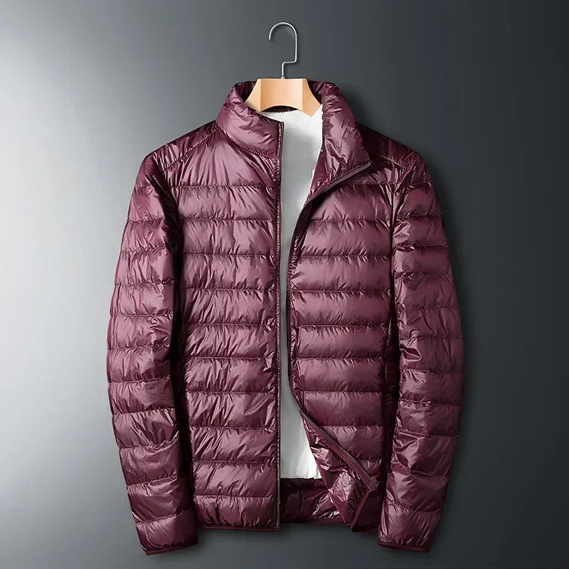 Burgundy waterproof puffer jacket with full-zip front and stand collar.