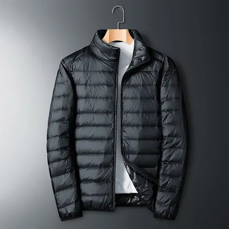 Black waterproof puffer jacket with full-zip front and stand collar.