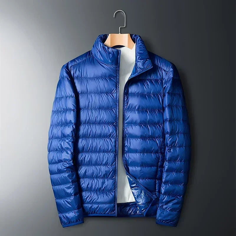 Blue waterproof puffer jacket with full-zip front and stand collar.