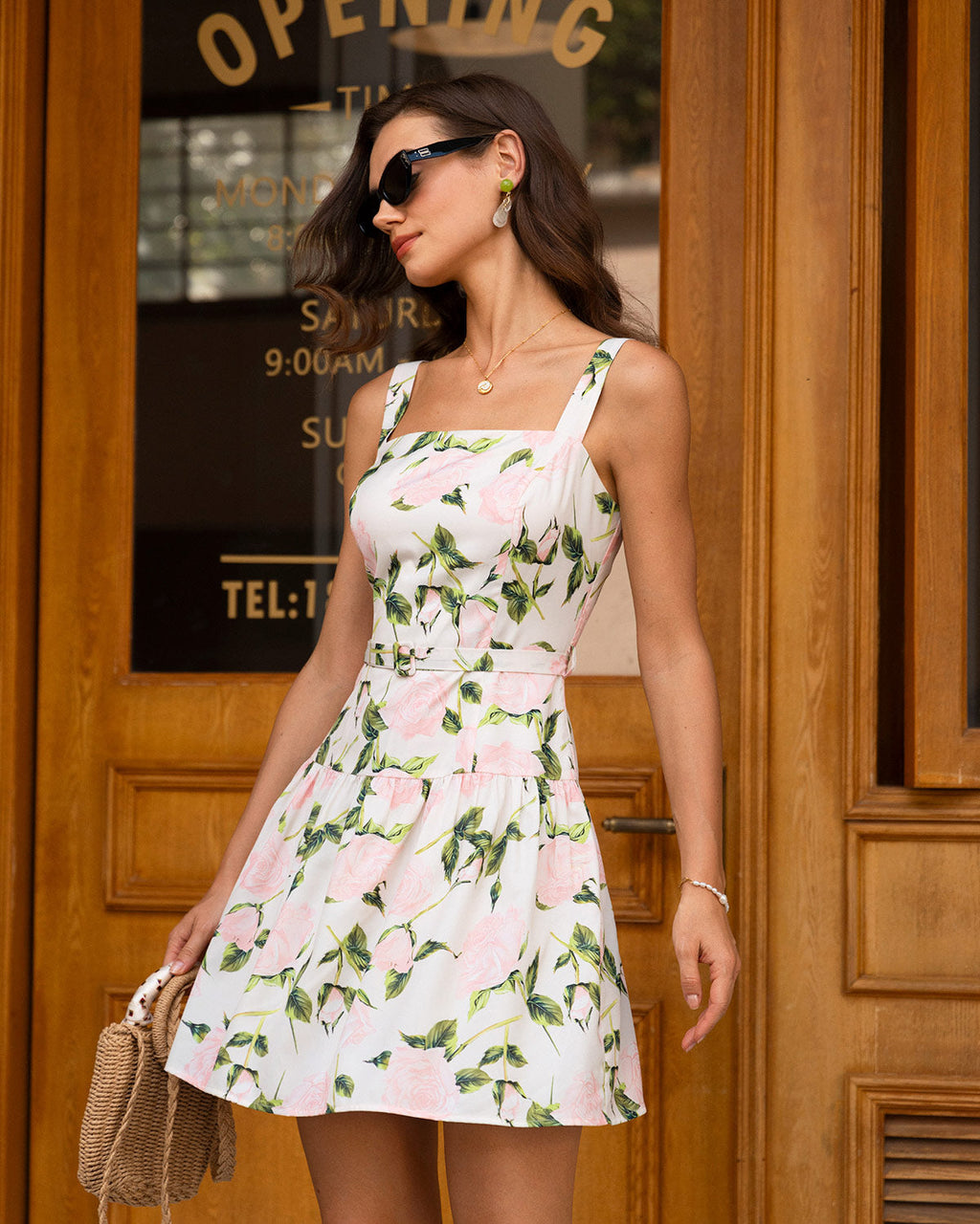 Women's floral mini dress with tiered skirt, pink roses and green leaves
