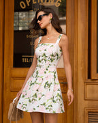 Women's floral mini dress with tiered skirt, pink roses and green leaves