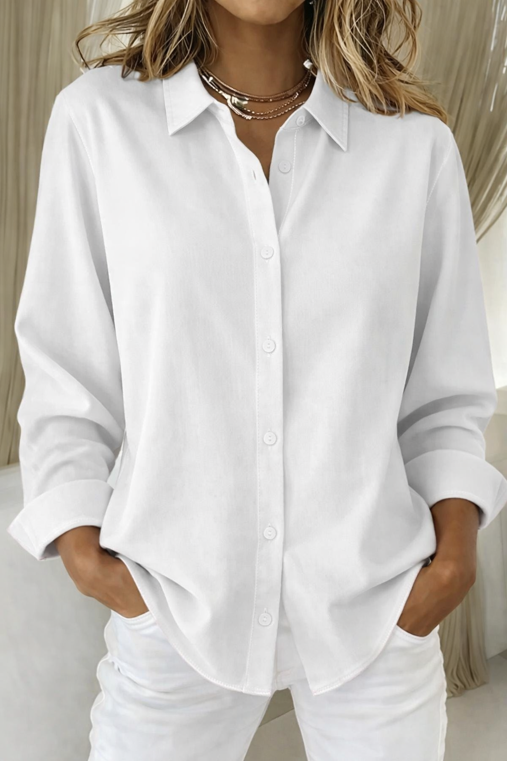 White point-collar button-down blouse with long sleeves, loose straight hem