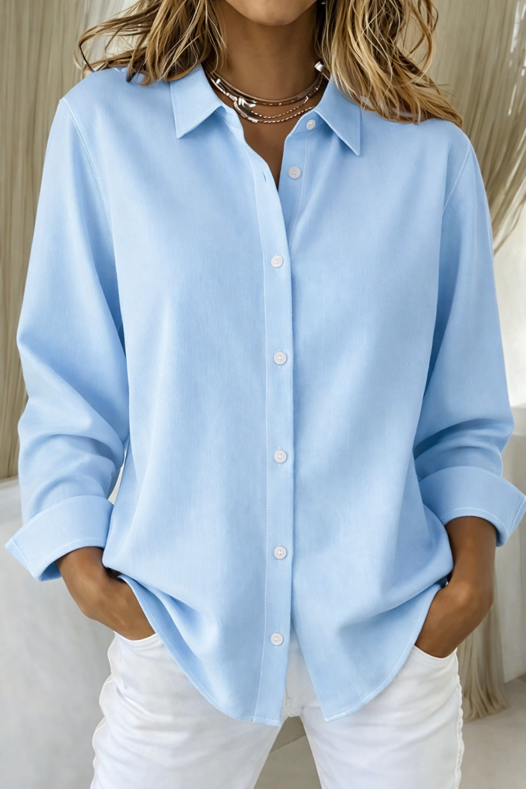 Light blue point-collar button-down blouse with long sleeves, loose fit