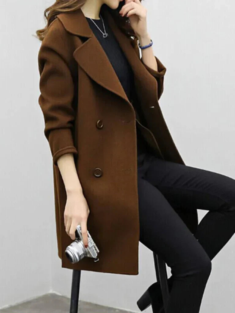Brown longline coat with wide lapels, button closure, and long sleeves