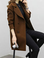 Brown longline coat with wide lapels, button closure, and long sleeves