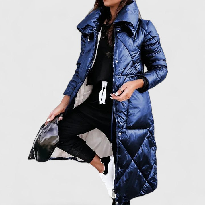 Blue long quilted coat with hood, button front, and side pockets