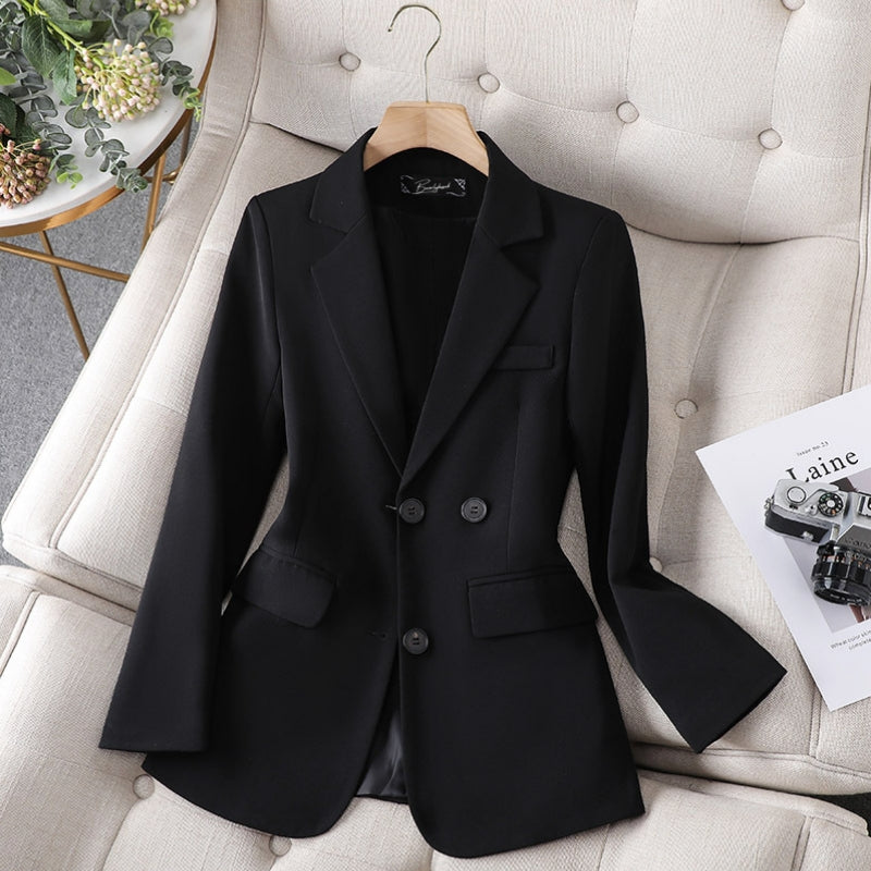 Black women’s slim-fit blazer with notch lapels and two-button front.