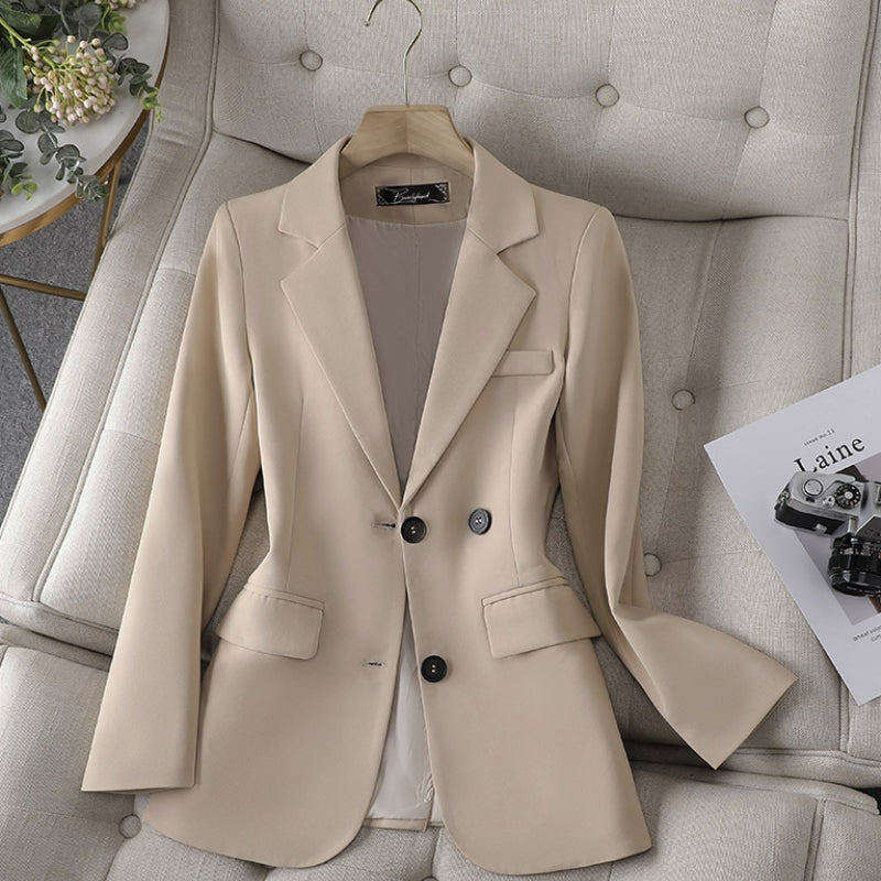 Beige women’s slim-fit blazer with notch lapels and two-button front.