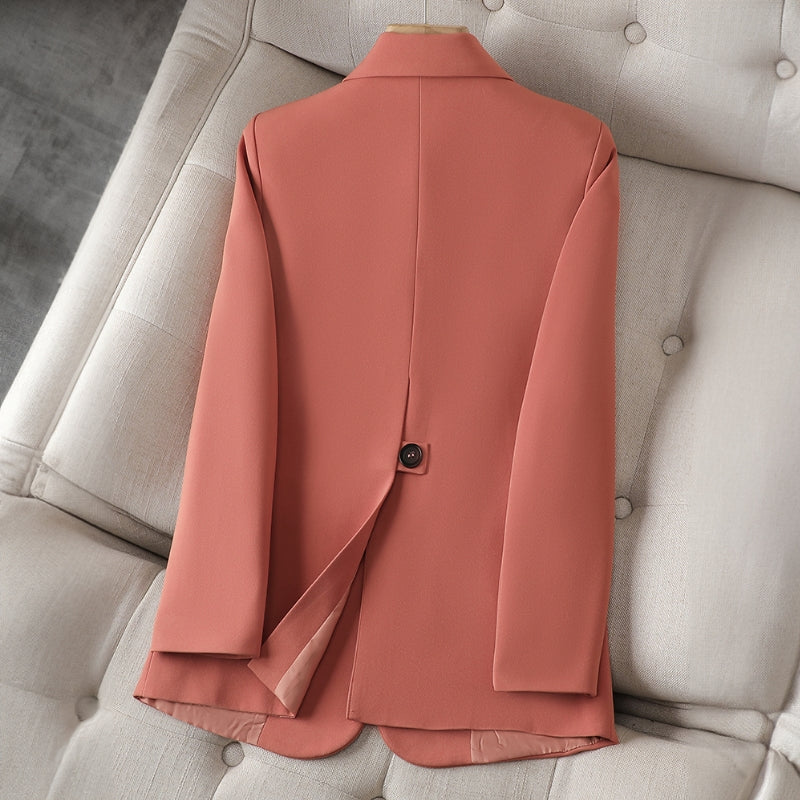 Coral women’s slim-fit blazer with back vent and two-button closure.