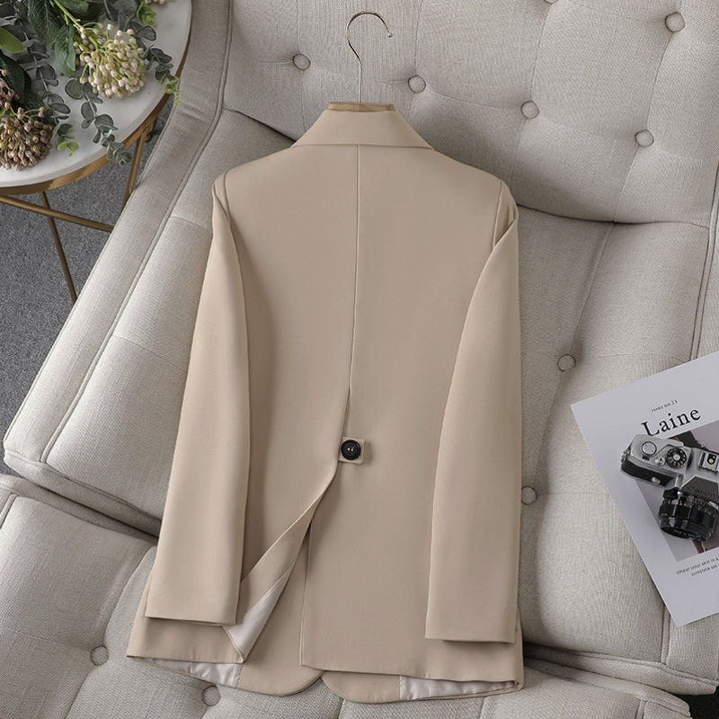 Light beige women’s slim-fit blazer with back vent and two-button closure.