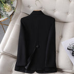 Black women’s slim-fit blazer with back vent and two-button closure.