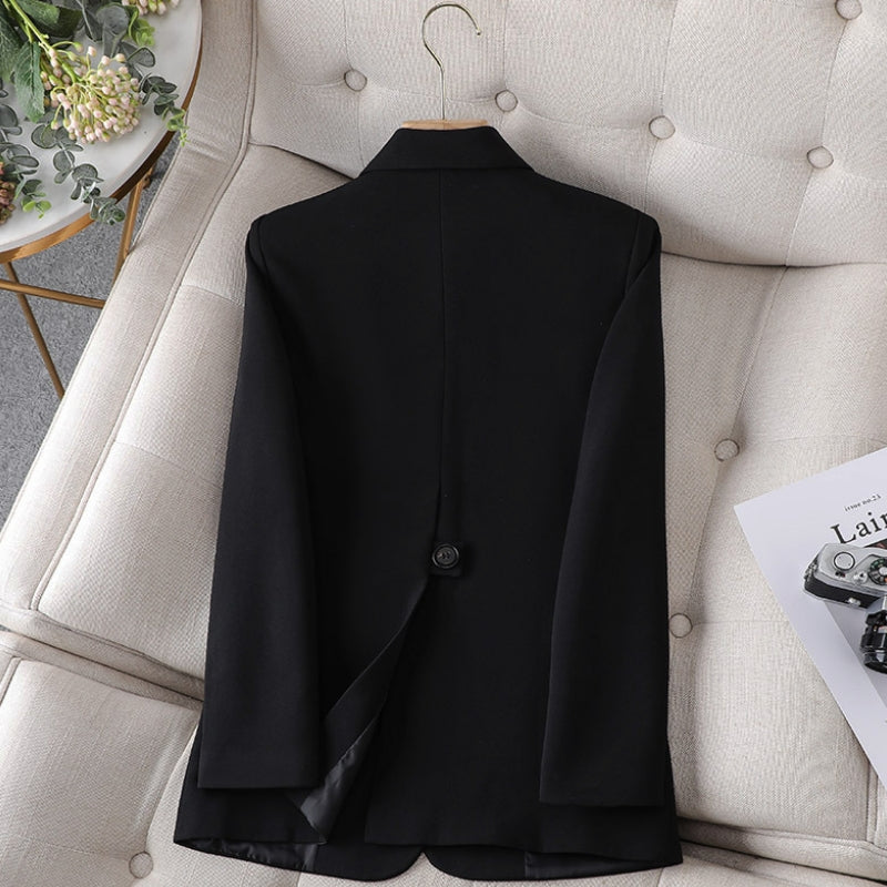Black women’s slim-fit blazer with back vent and two-button closure.