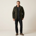 Men's lined dark green utility jacket with multiple flap pockets and adjustable waist tabs