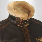 Tan fur trapper-style collar with buckle strap on brown leather flight jacket