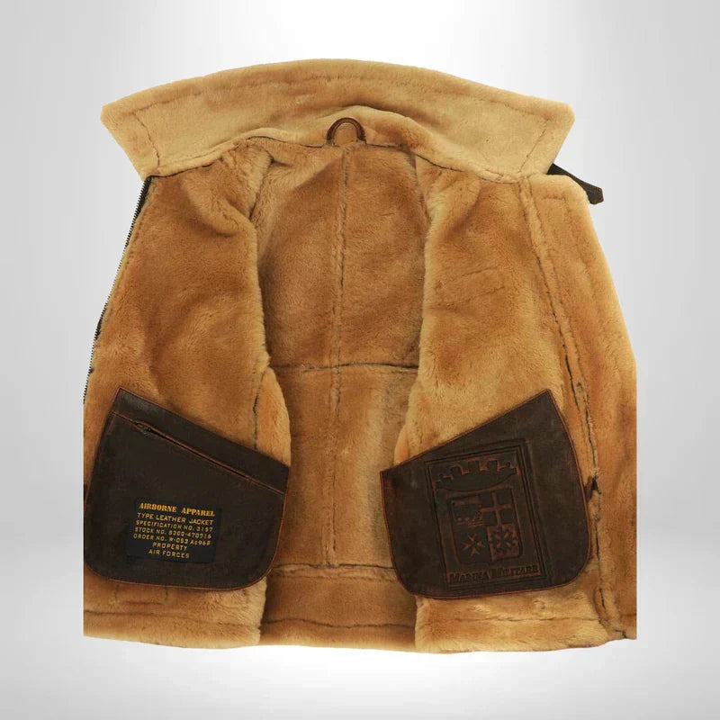 Tan fur-lined interior hood with brown leather patch pockets on flight jacket