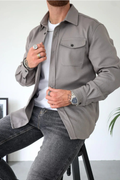 Light gray men’s button-front overshirt with flap chest pockets, long sleeves