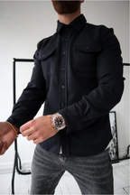 Black men’s button-front overshirt with two flap chest pockets and long sleeves