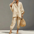 Apricot two-piece batwing blouse and relaxed pants set with side pockets