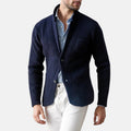 Men's navy blazer jacket with notch lapels, button front, and flap pockets