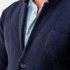 Men's navy blazer jacket close-up of button front and chest pocket