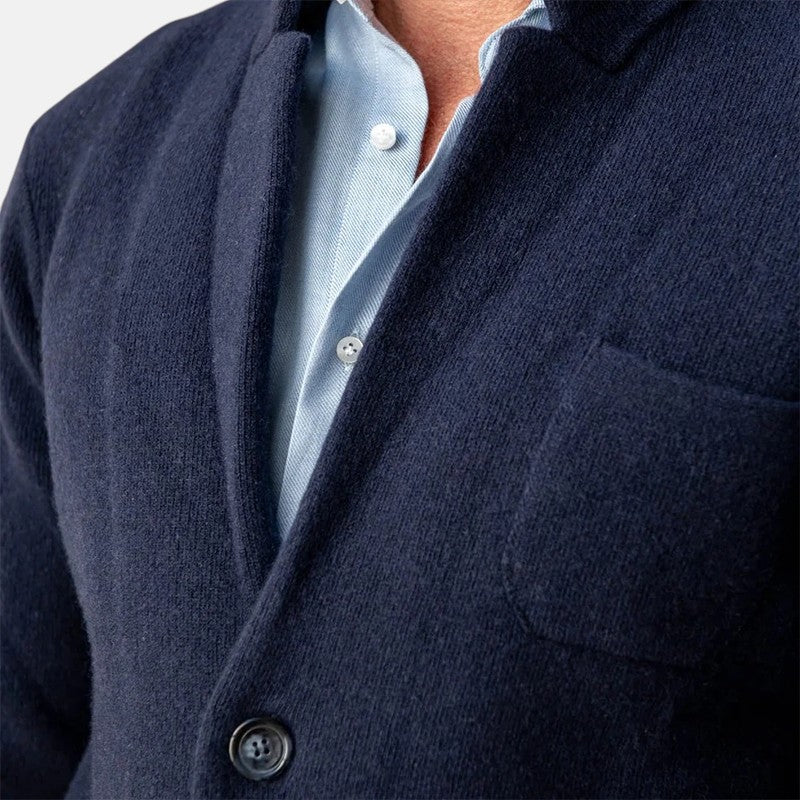 Men's navy blazer jacket close-up of button front and chest pocket