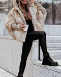 Apricot hooded puffer coat with faux-fur trim, snap front, and ribbed knit cuffs