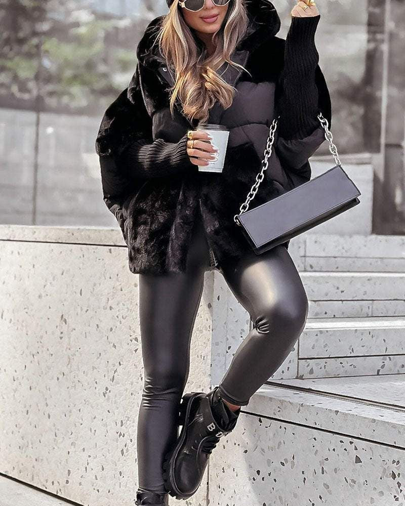 Black hooded puffer coat with faux-fur texture and front zip closure