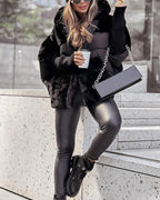 Black hooded puffer coat with faux-fur texture and front zip closure
