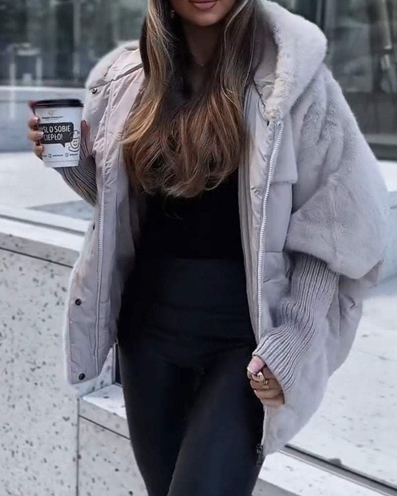 Light gray hooded puffer coat with faux-fur trim and full-length front zipper
