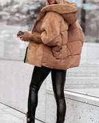Brown hooded puffer coat with faux-fur hood trim and snap front