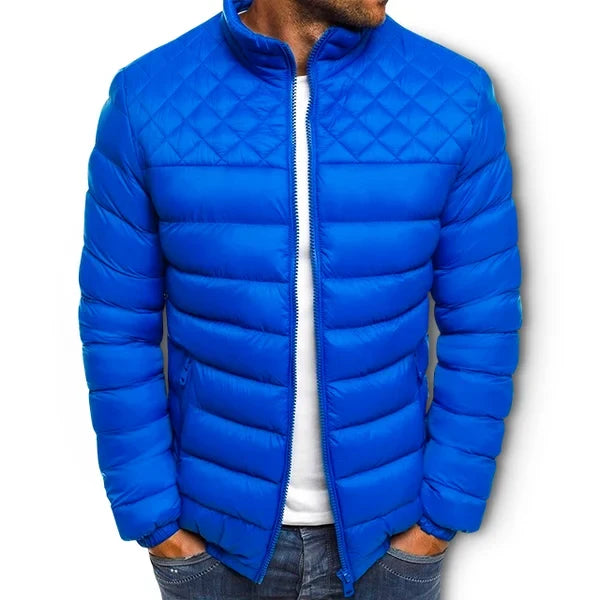 Men's quilted puffer winter jacket in royal blue with full zip and stand collar.