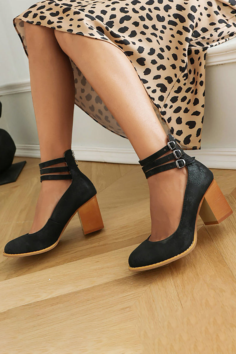 Black triple-buckle block heel ankle strap pumps with three strap bands and buckles.