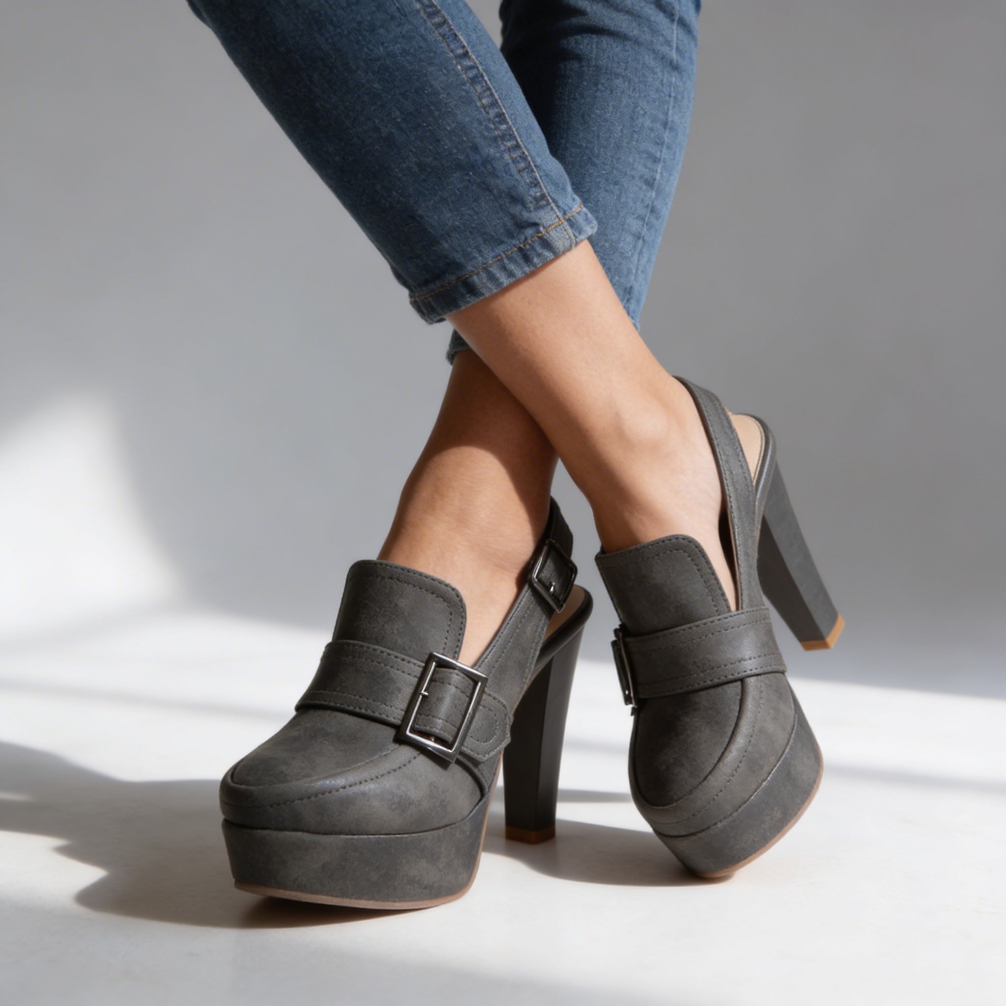 Dark gray platform loafer slingback heels with two square buckle straps and chunky block heel