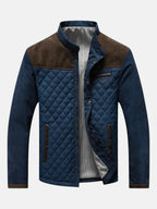 Men's designer jacket with quilted navy front, blue sleeves, brown collar and pockets