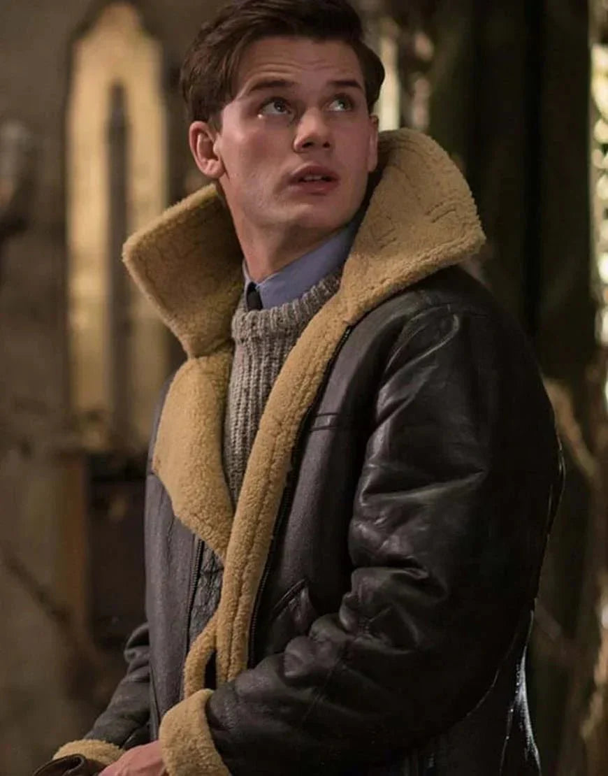 Brown leather jacket with tan shearling collar and thick shearling trim at cuffs
