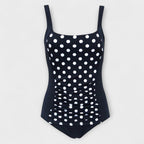 Ruched one-piece swimsuit in black with white polka dots, wide straps