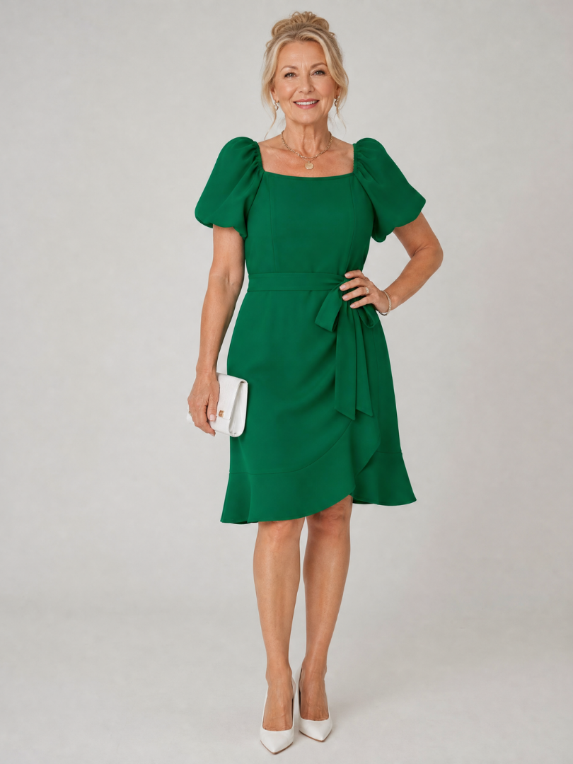 Green mini dress with puff sleeves, square neckline, and side tie detail at waist