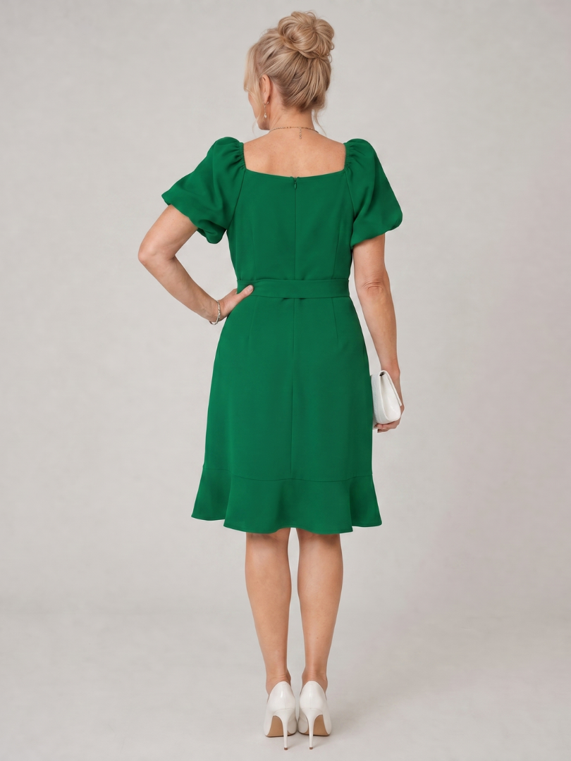 Green back view mini dress with puff sleeves and waist tie detail