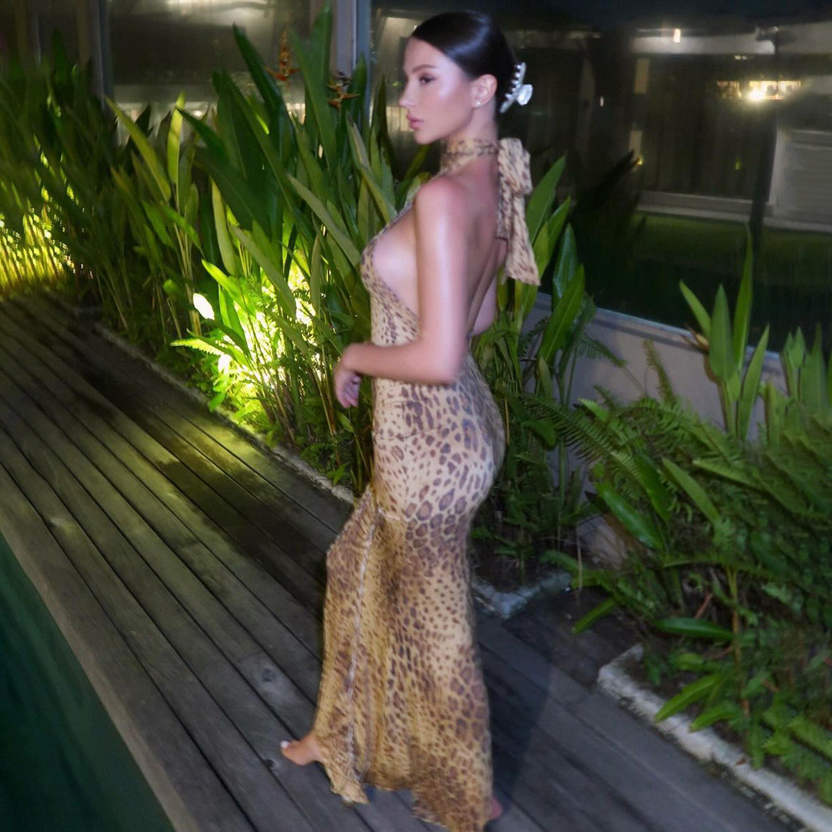 Leopard-print backless sleeveless maxi dress, side view with halter neckline