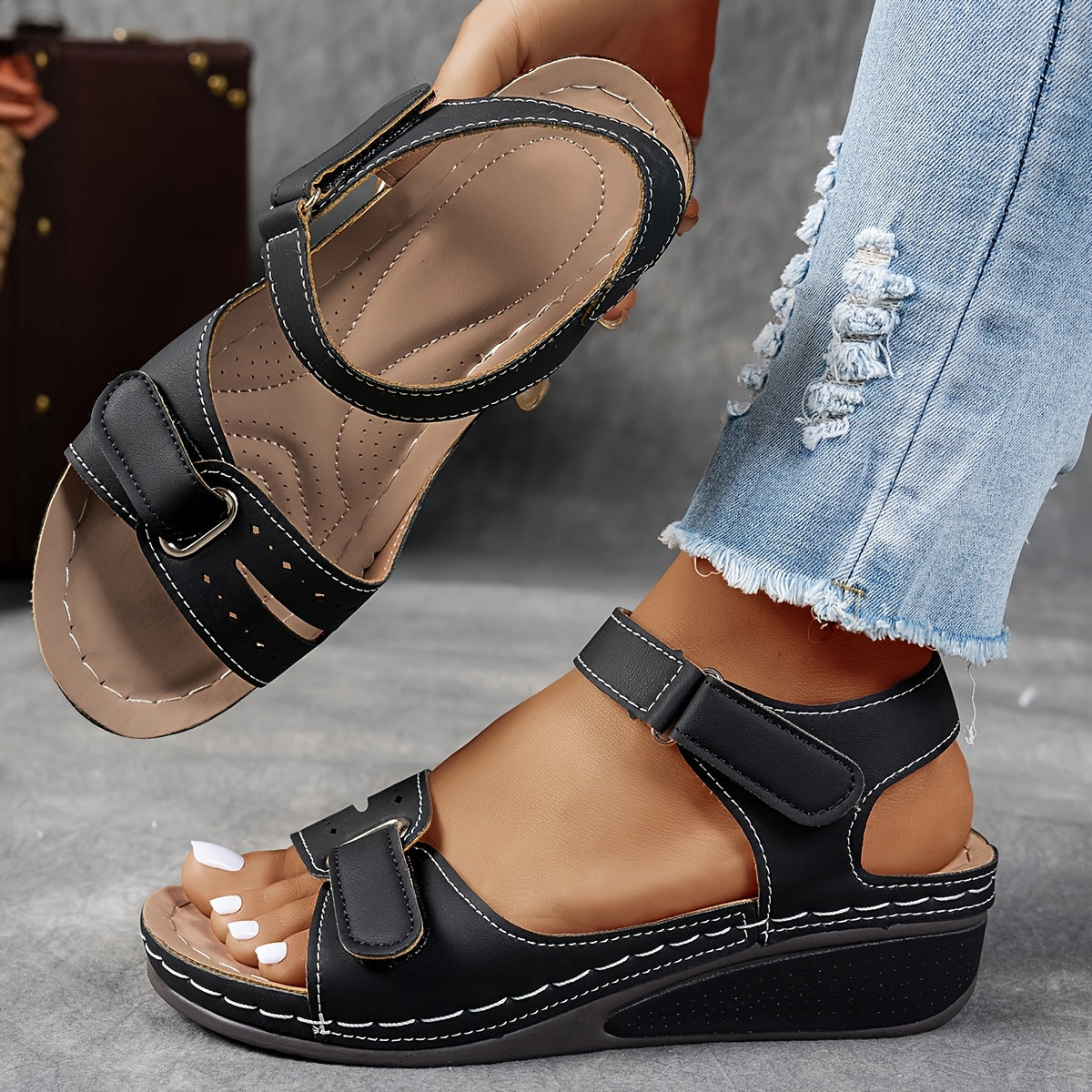 Black slip-on support sandals with two hook-and-loop straps and cushioned footbed