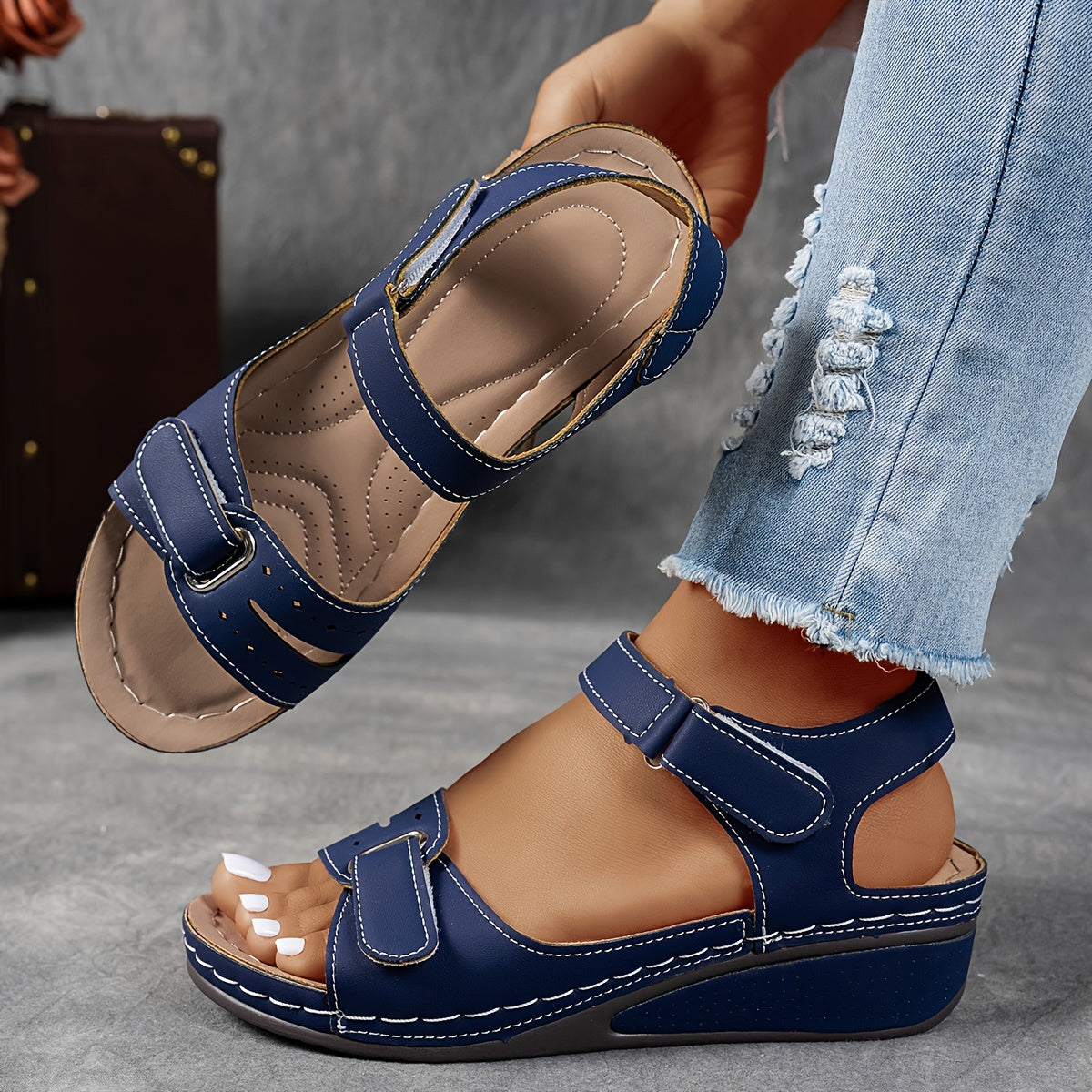 Navy slip-on support sandals with two straps, cushioned footbed, and flexible sole