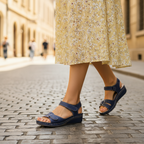 Navy slip-on support sandals with two hook-and-loop straps and cushioned insole