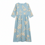 Light blue embroidered midi dress, round neck, 3/4 sleeves, gathered waist, flowy silhouette.
