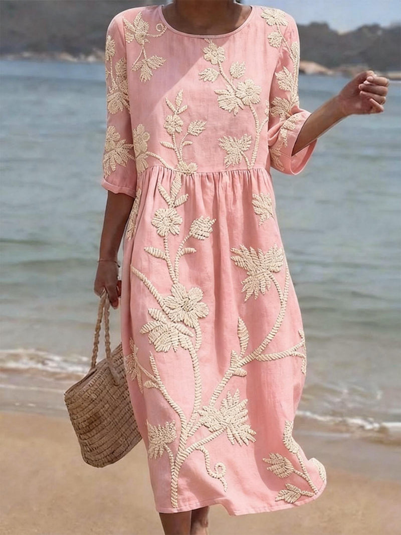 Light pink embroidered midi dress, round neck, 3/4 sleeves, gathered waist, flowy fit.