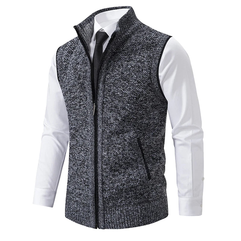 Dark gray fleece zip-up vest with stand collar and side welt pockets